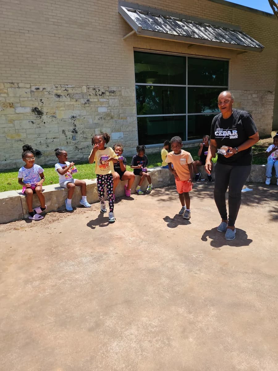 Children participating in an outdoor Cedar Hill Action Team activity