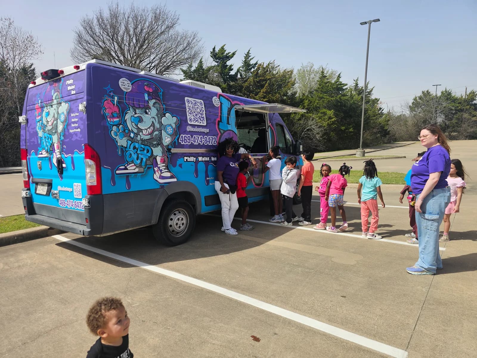 Families lined up at the Iced Out truck during a Cedar Hill Action Team event