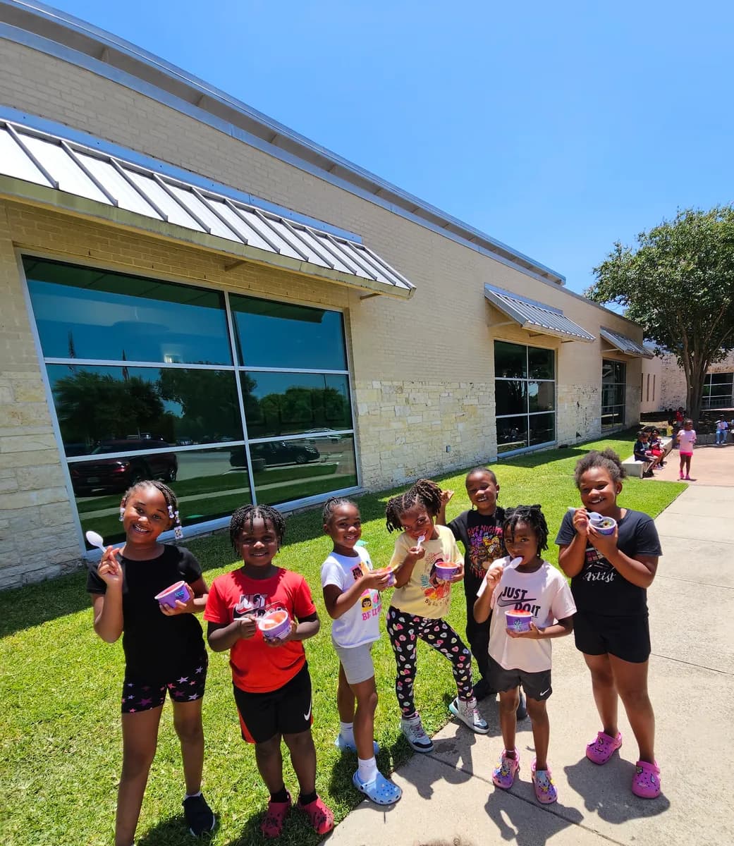 Children enjoying Iced Out cups together at a Cedar Hill Action Team event