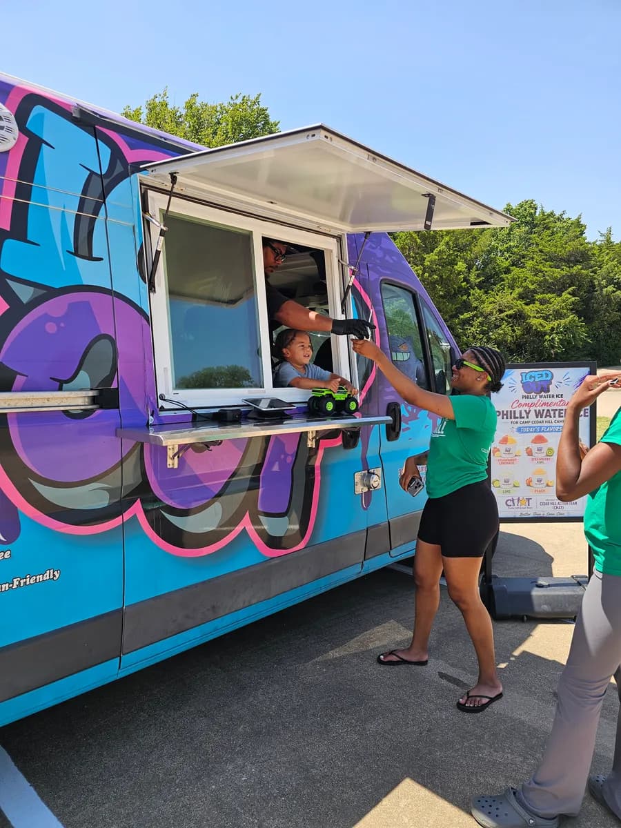 The Iced Out truck serving complimentary water ice at Camp Cedar Hill for CHAT campers