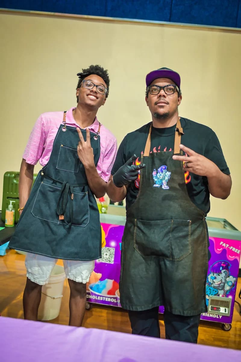 Iced Out team serving Philly water ice at a FreshQue Foundation community event
