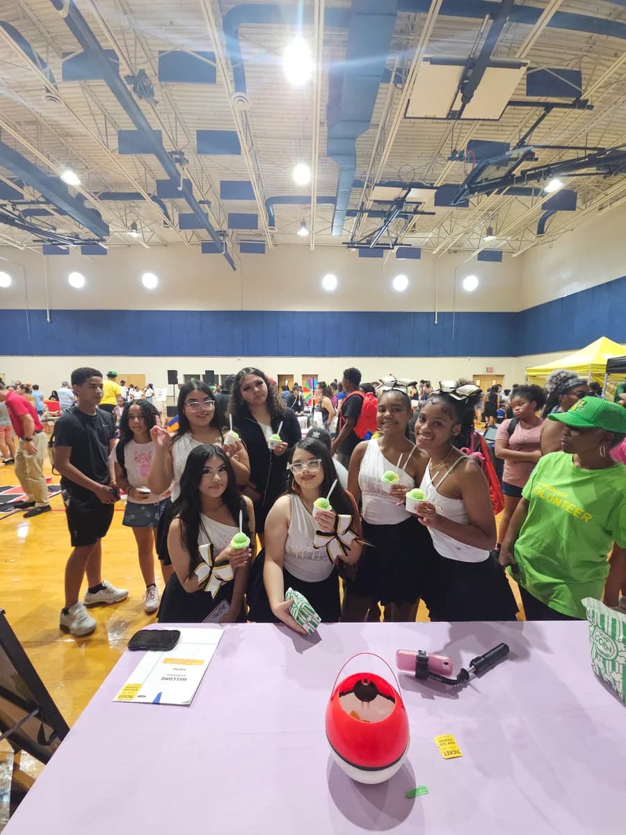 Kids posing with cups of Iced Out water ice at a FreshQue Foundation and Mercy Street event