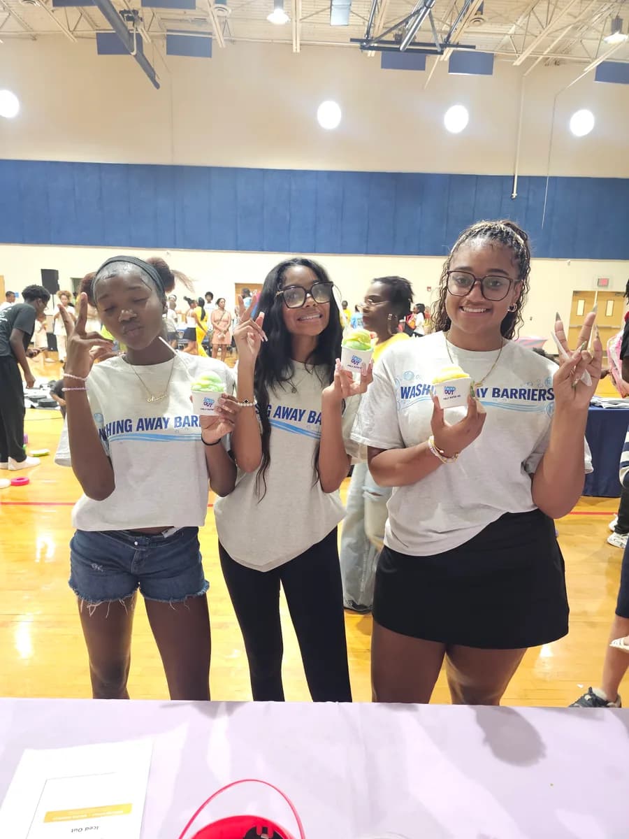 Youth enjoying Iced Out water ice at a FreshQue Foundation and Mercy Street Dallas event