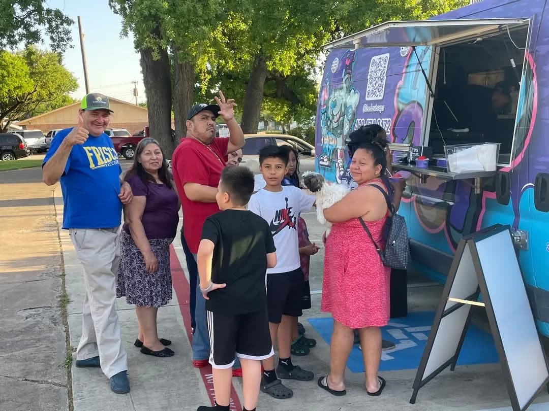 Families gathering at the Iced Out truck during a Table Irving event