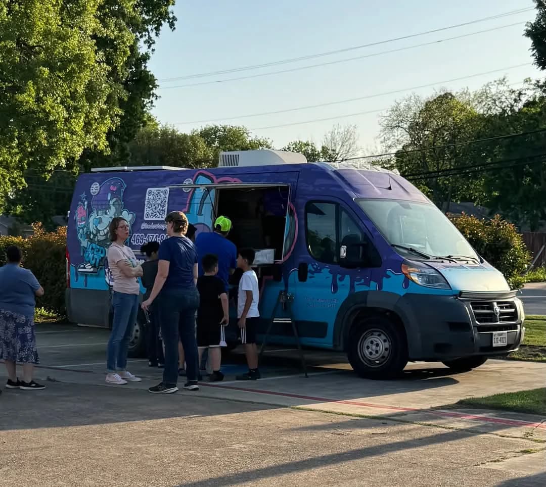 The Iced Out truck serving guests at an evening Table Irving event